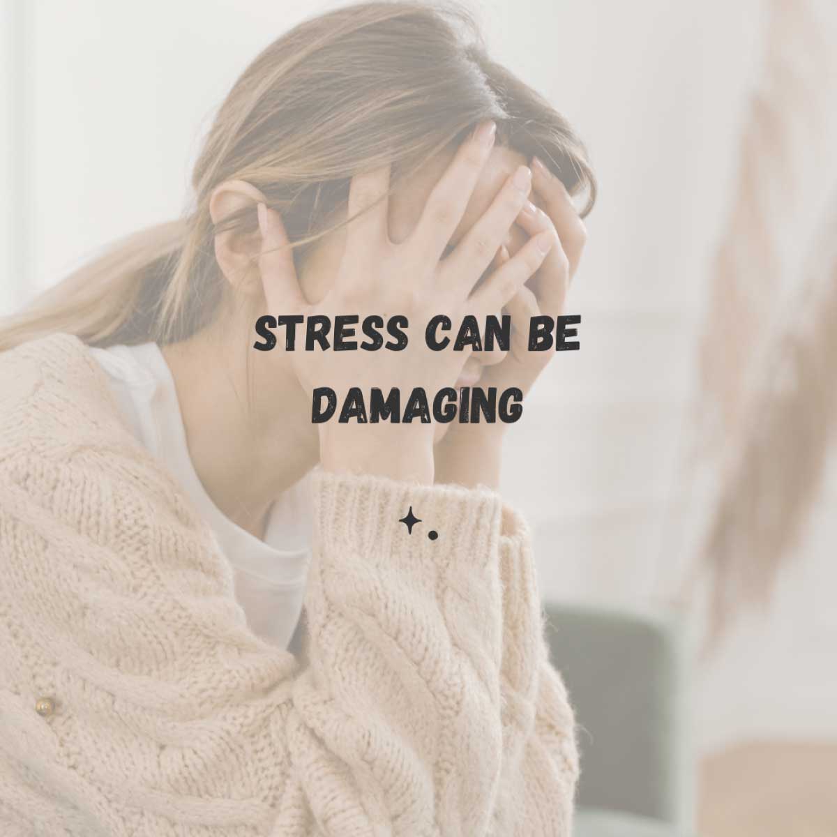stress can be damaging - a woman sitting with her head in her hands and appears to be stressed out.